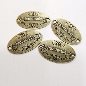 CH65786 Μεταλλικα διακοσμητικα ραπτικης “handmade” 30x19mm/1τεμ. μπρονζε χρωμα (0 0)
